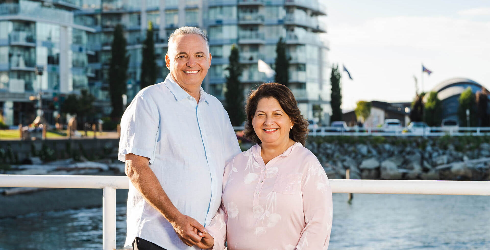 Tony and Anna Clemente standing together on the ocean walkway in Sidney on a sunny day